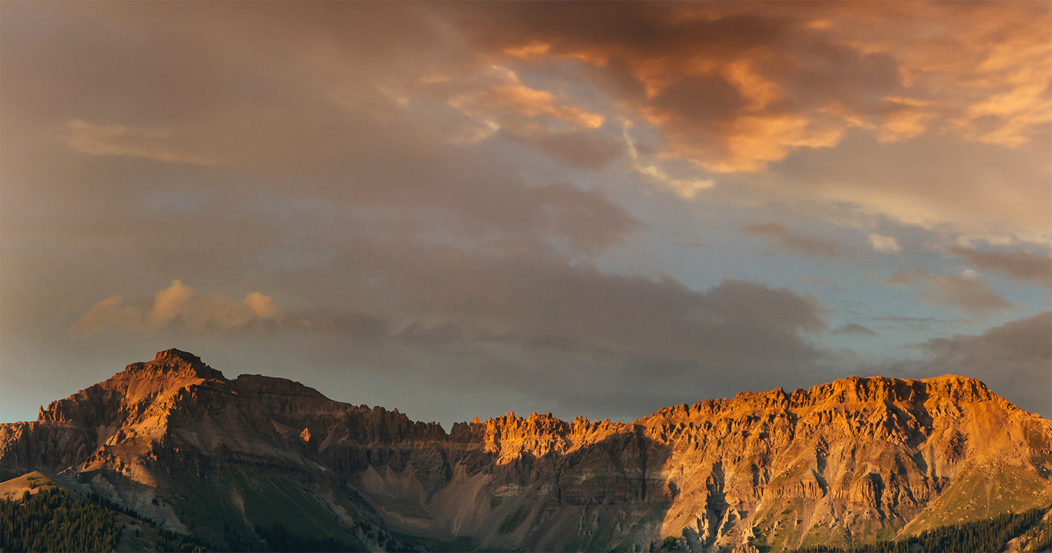 Footer Background image of clouds over a mountain